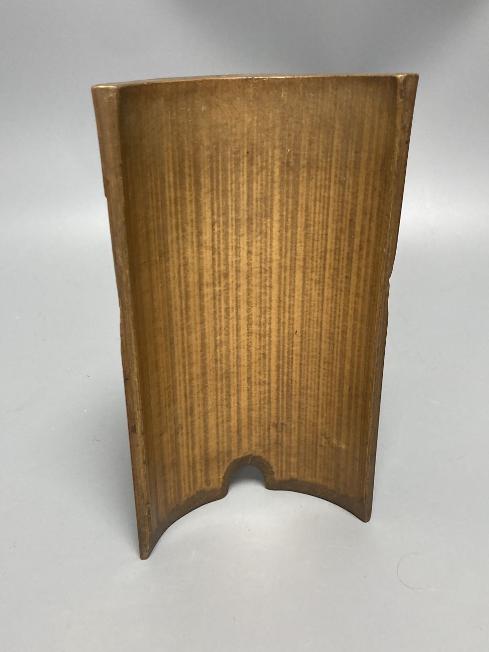 A Chinese bamboo group of figures on an ox and a wrist rest, 23 and 17cm